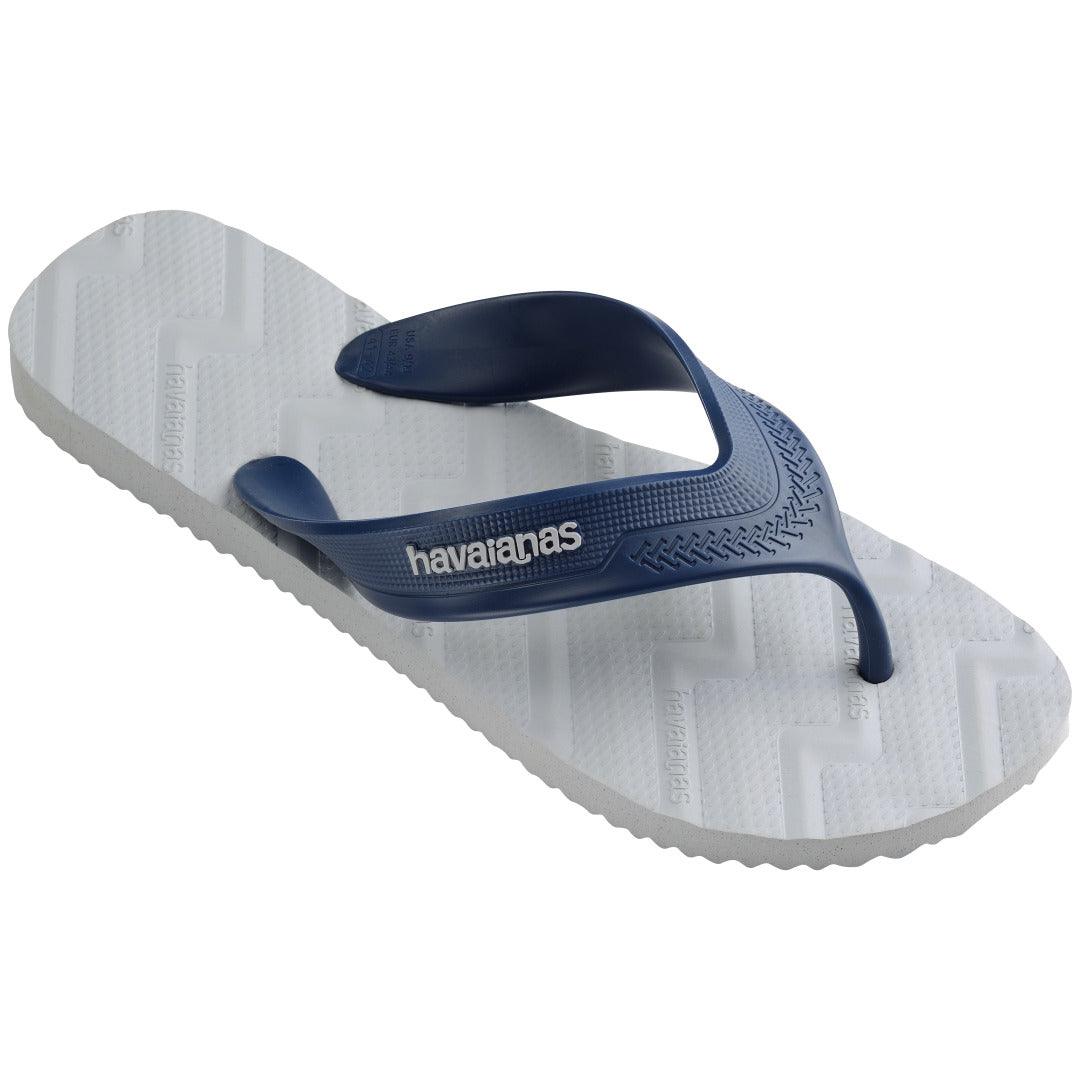 Chinelo Havaianas Track Waves em ângulo 3/4 mostrando palmilha texturizada cinza gelo e tira azul marinho